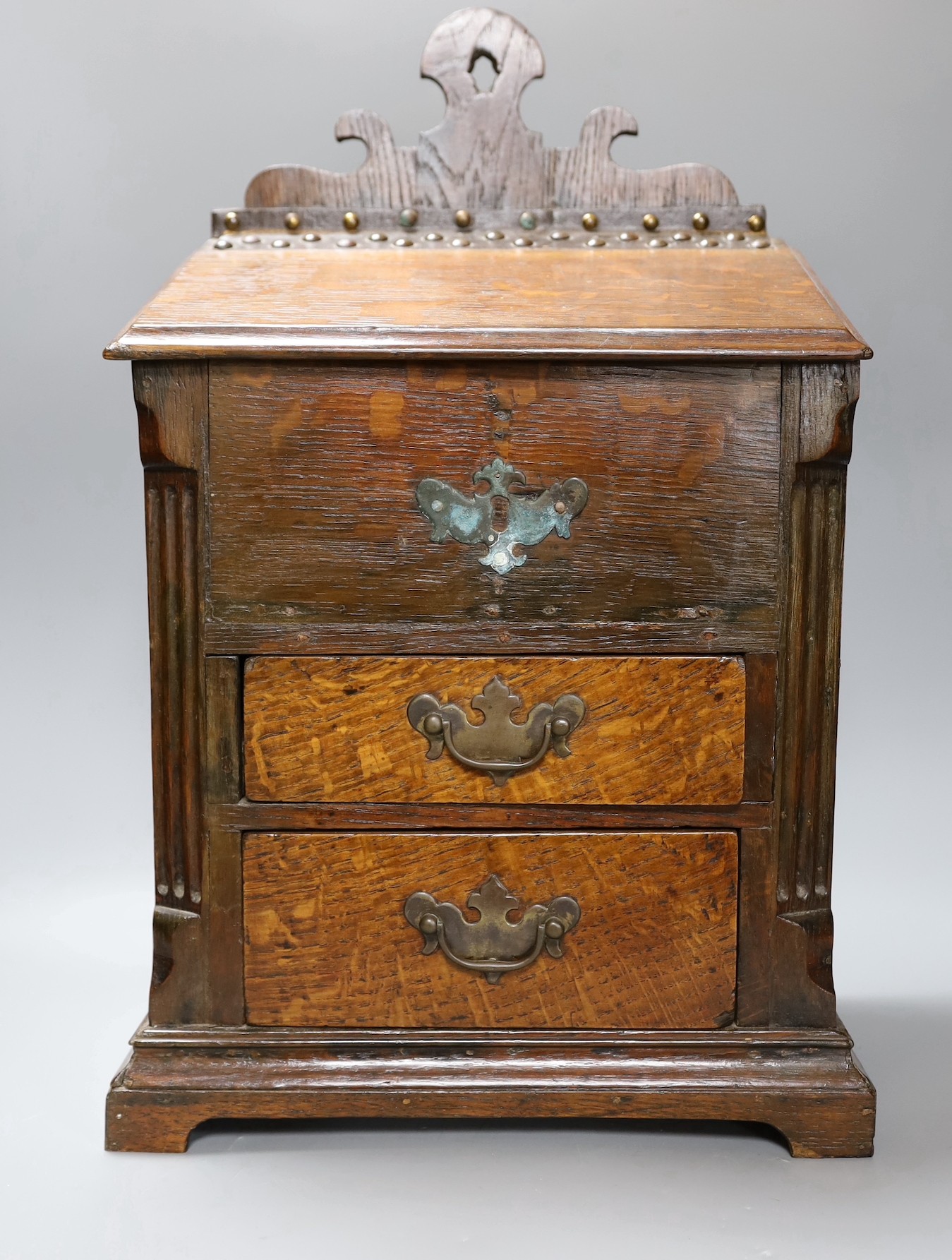 An 18th century and later oak spice cupboard, 53 cms high